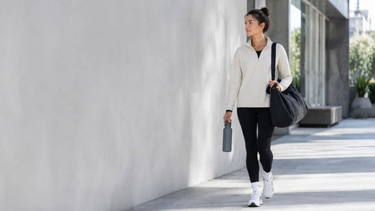 Modern active commute scene with a gym bag and water bottle for daily hydration and fitness routines