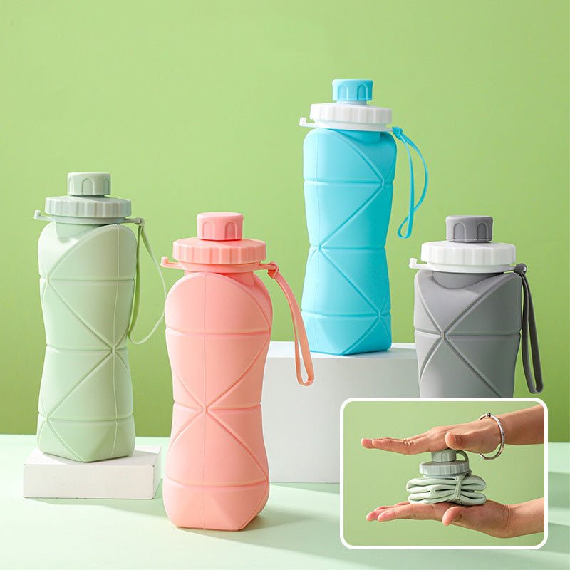 collapsible silicone travel water bottles in blue green pink and gray