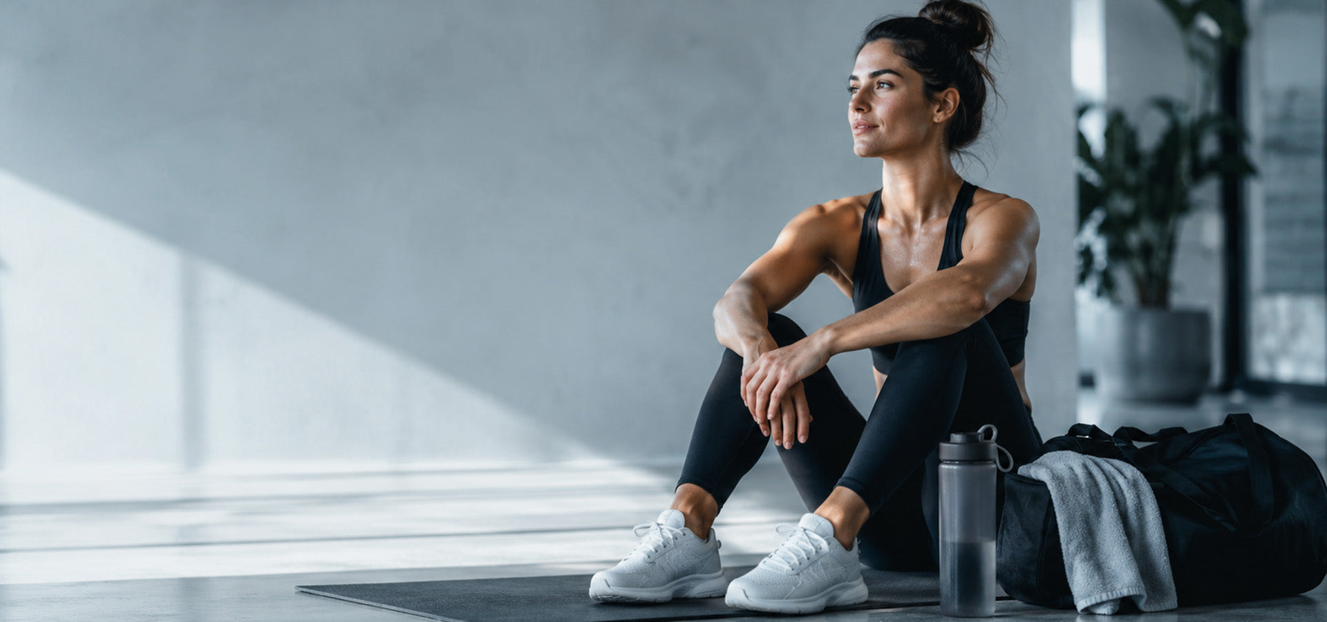 Clean post-workout studio scene with hydration essentials and active lifestyle context for Yiran Sportslife
